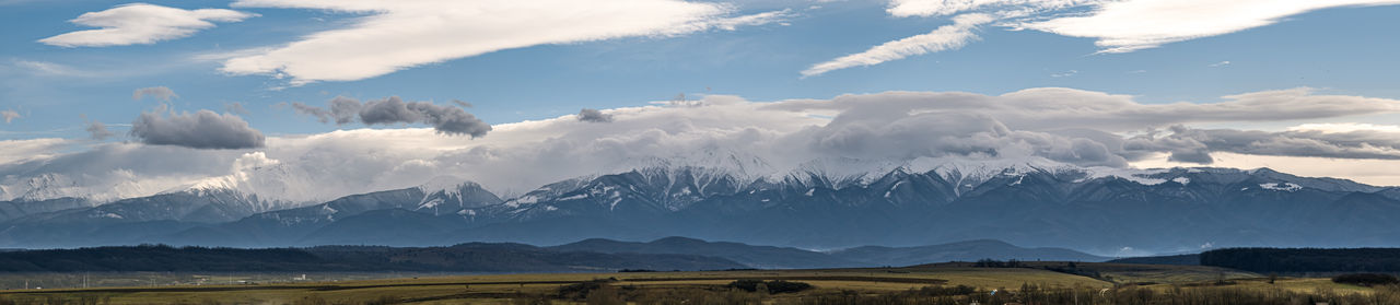 Panoramic view of the snow covered fagaras mountains, part of the carpathian mountains.