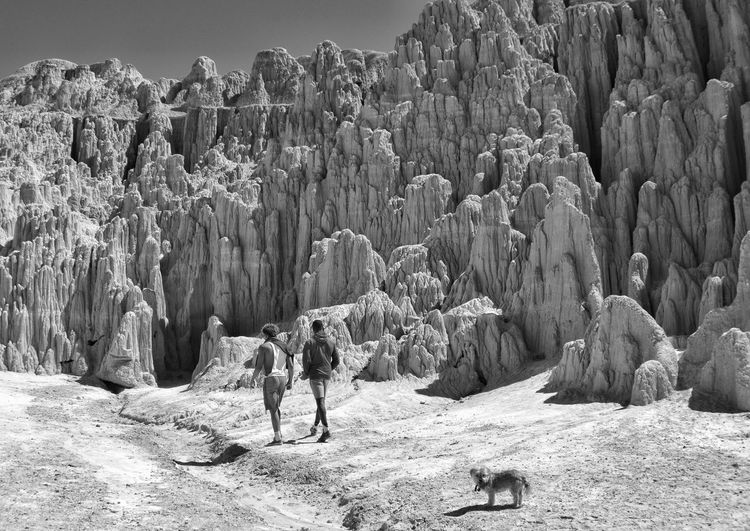 Tourists against rock formations