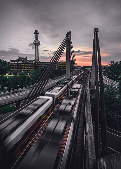High angle view of trains on railway bridge during sunset