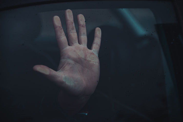 Close-up of woman hand on mirror