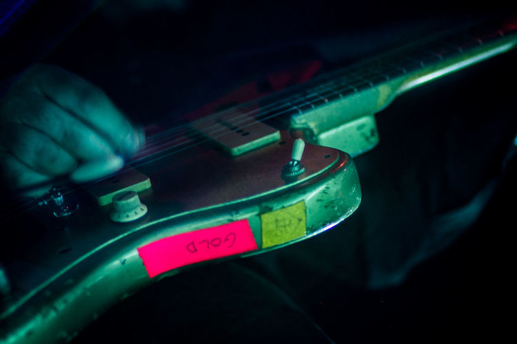 Close-up of hand on guitar