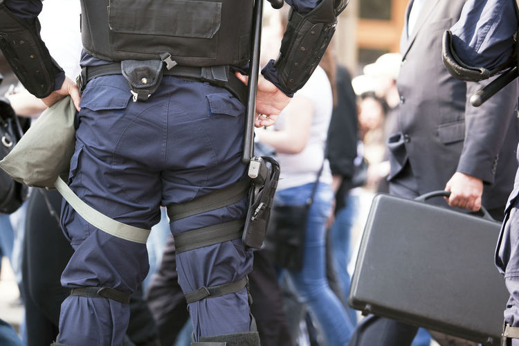 Midsection of policeman