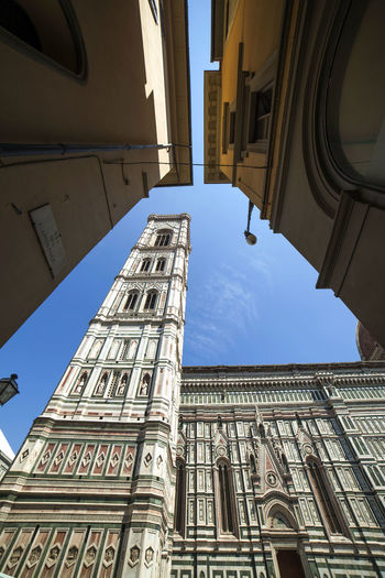 Low angle view of duomo santa maria del fiore during sunny day
