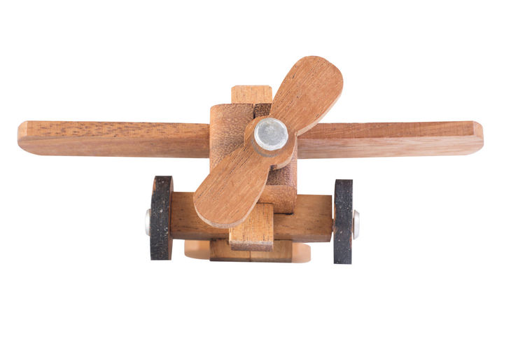 High angle view of cross on wood against white background