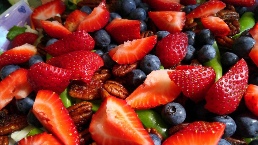 High angle view of strawberries and blueberries