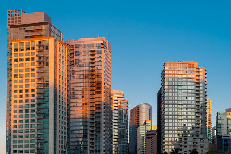 Low angle view of buildings against blue sky