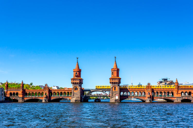 View of bridge over river with buildings in background