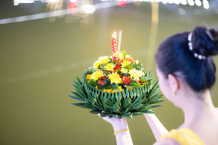 Rear view of woman with bouquet