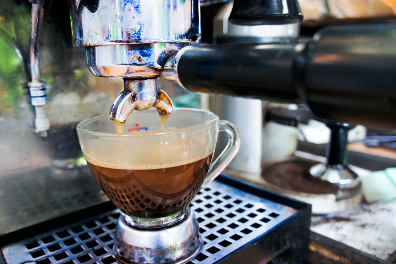 Close-up of pouring coffee in cafe
