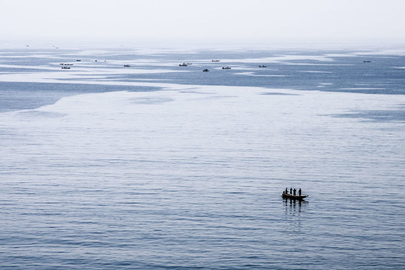 People in boat on sea