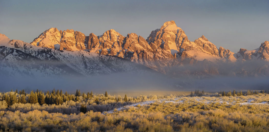 Scenic view of mountains against sky during winter