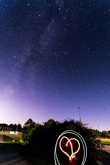 Light painting against sky at night