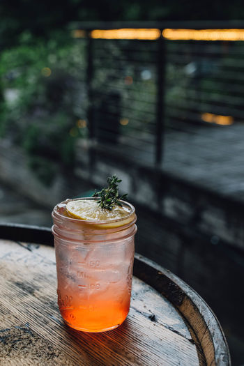 Strawberry thyme lemon cocktail drink in mason jam jar summertime