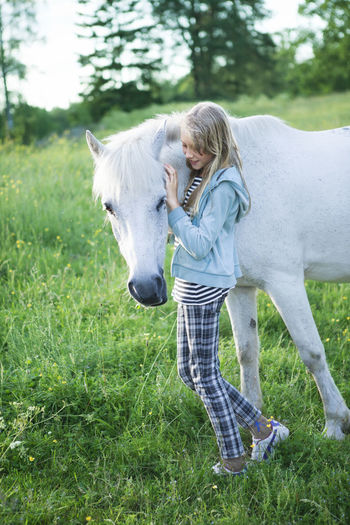 Girl with white horse
