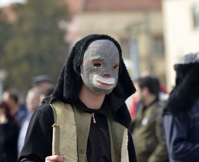 Close-up of man wearing mask at carnival