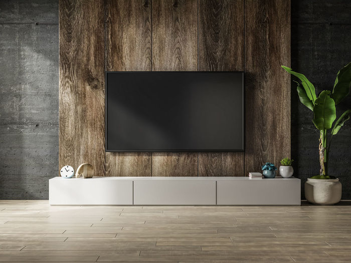Cabinet with wooden wall mounted tv in interior concrete room.3d rendering