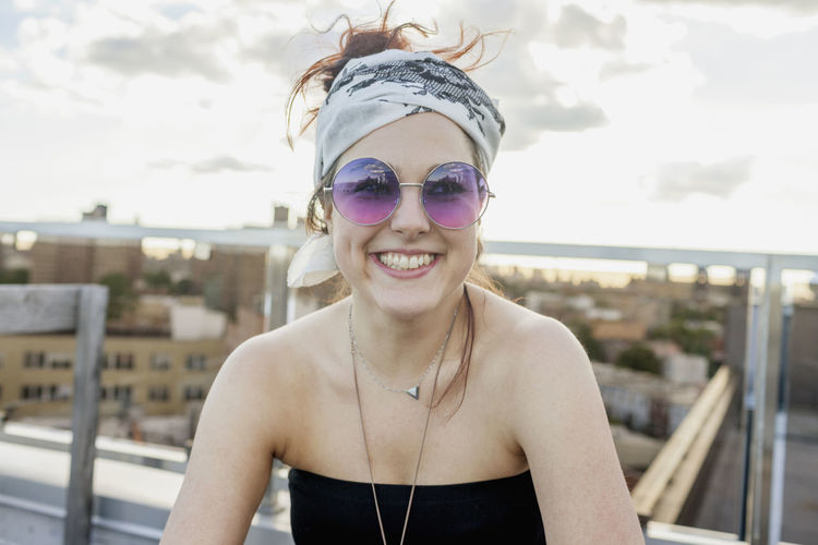 Portrait of a young woman wearing sunglasses