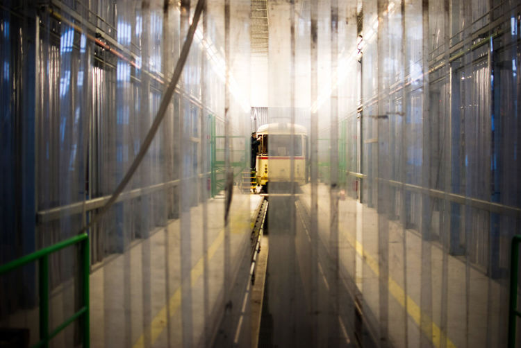 Mid distance view of man repairing train
