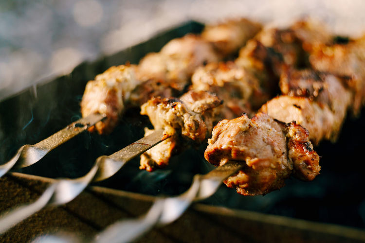 Close-up of meat on barbecue