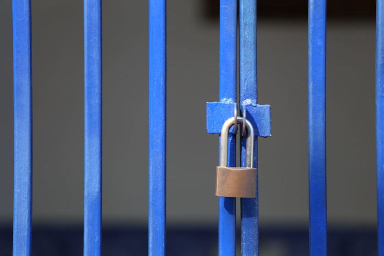 Close-up of padlock on gate