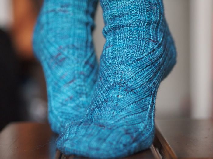 Close-up of feet with blue socks
