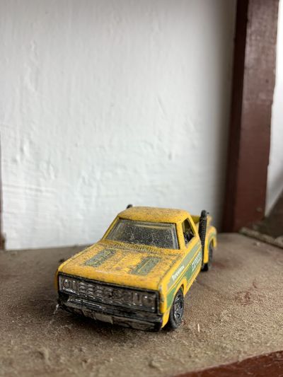 Close-up of toy car against wall