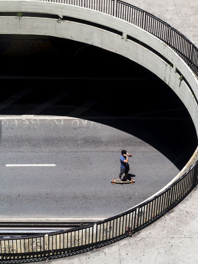 Skateboarder at paulista avenue in sao paulo at a tunnel entrance