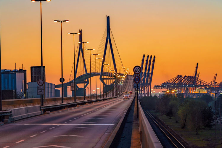 View of bridge over city against sky during sunset - köhlbrandbrücke hamburg 