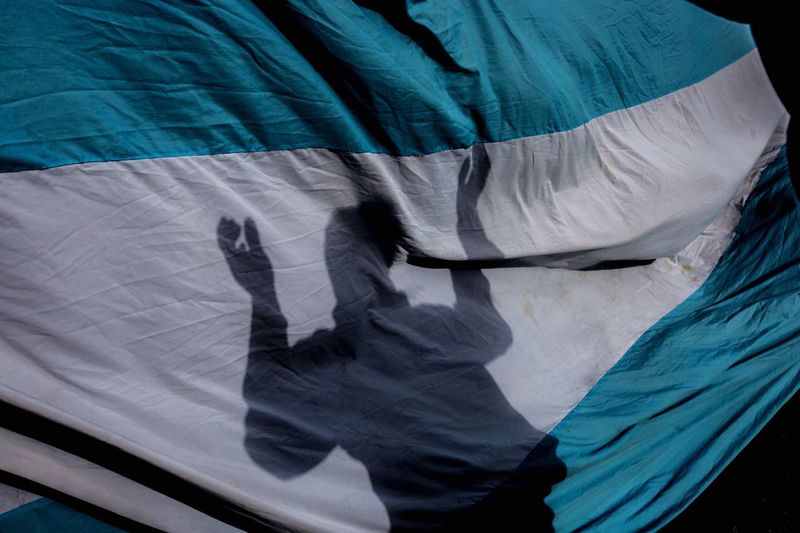 Shadow of person on fabric