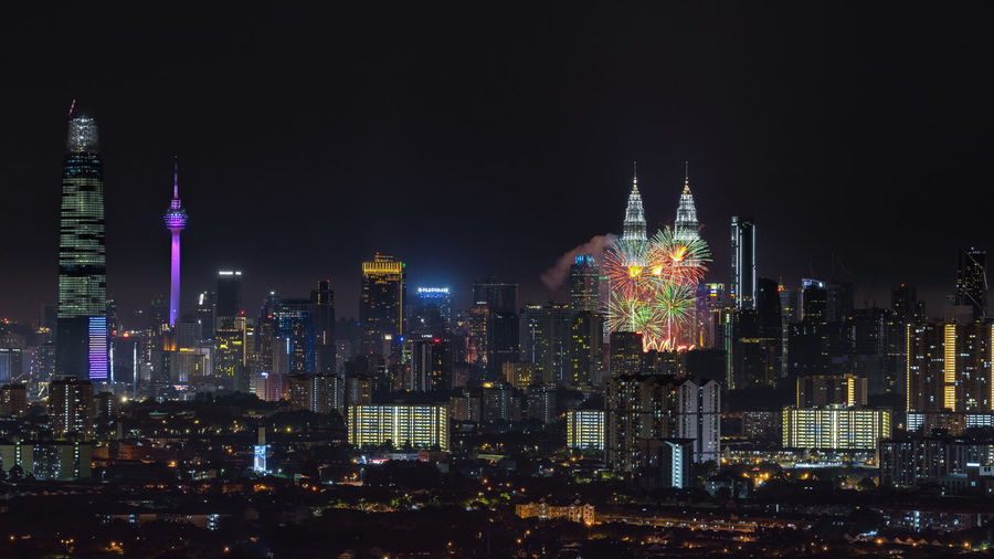 High angle view of city against sky at night