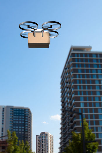Delivery drone flying above the city