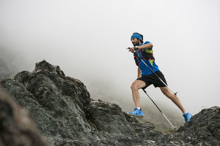 Italy, alagna, trail runner on the move near monte rosa mountain massif