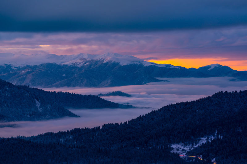 Scenic view of lake against sky during sunset
