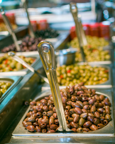 Close-up of olives for sale at market stall