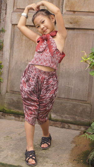 Full length of a smiling young woman