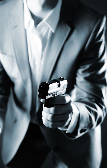 Midsection of businessman playing chess