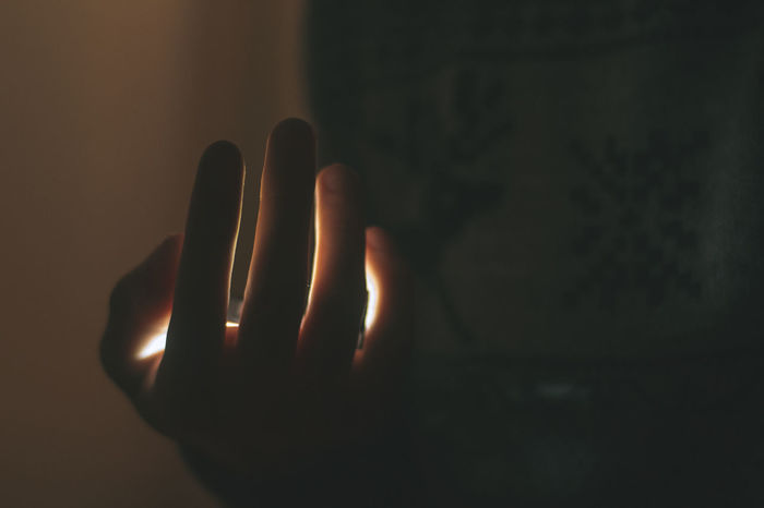 Close-up of human hand against blurred background