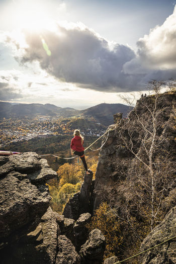 Young woman highlining at baden-baden, germany