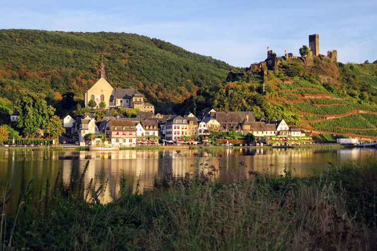 Moselle river against buildings and mountains