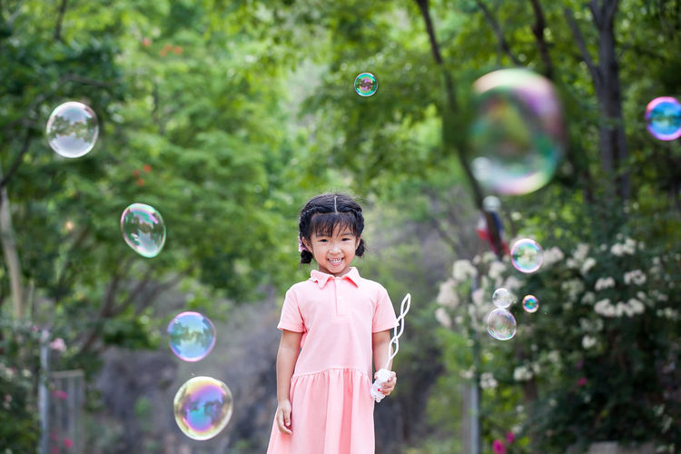 Full length of girl with bubbles