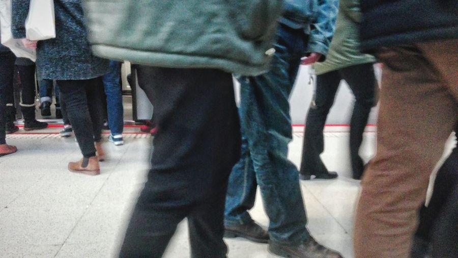 Low section of man standing on floor