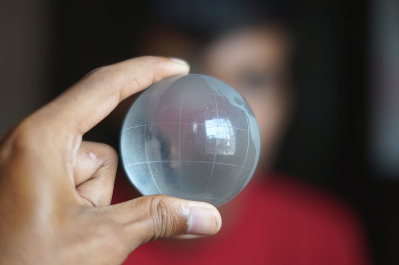 Woman holding crystal globe