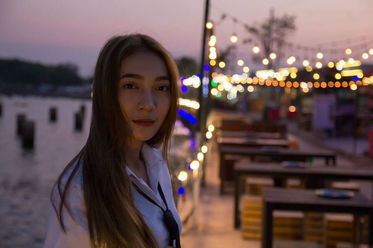 Portrait of sailor at harbor during sunset