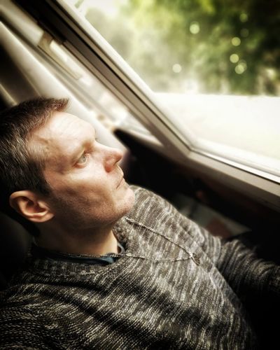 Portrait of man in car
