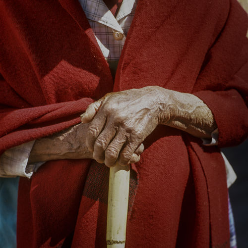 Midsection of senior man holding walker