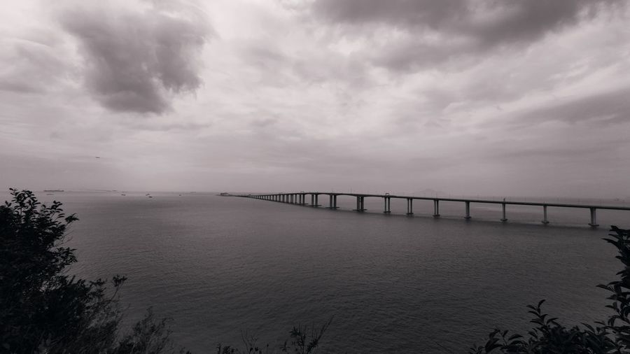 Bridge over sea against sky