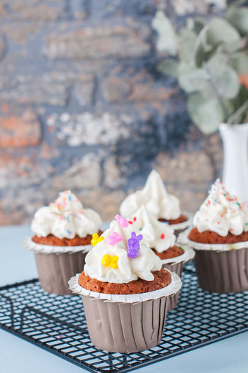 Close-up of cupcakes with ice cream on table