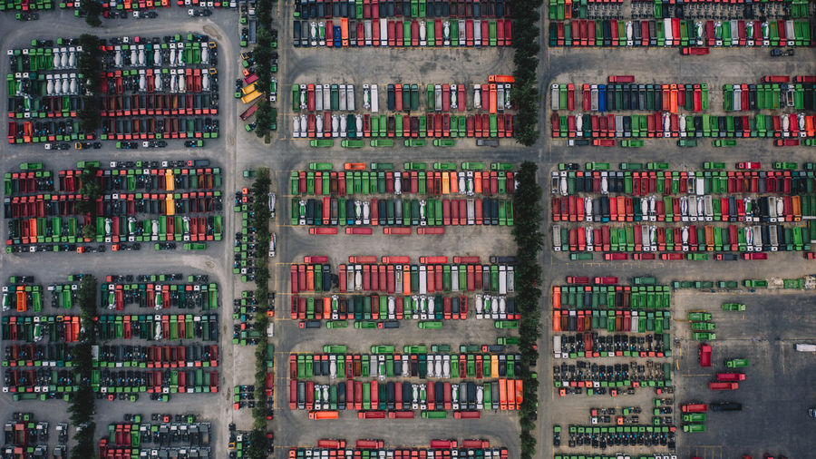 Aerial view of trucks parked in row on land
