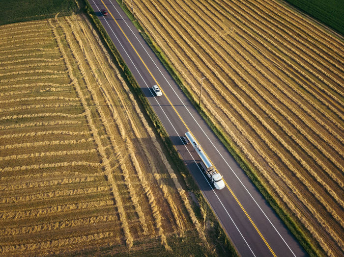 High angle view of highway amidst field