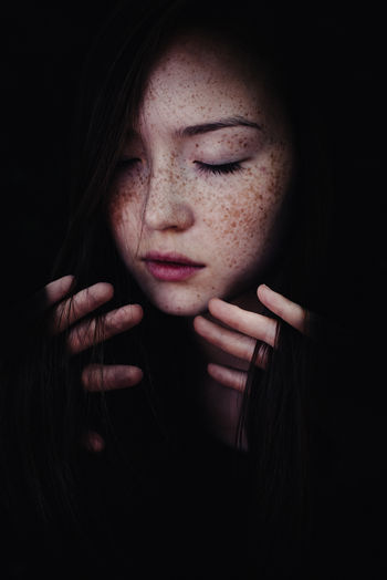 Adult Adults Only Beautiful Woman Beauty Black Background Close-up Freckle Human Body Part Human Hand Human Lips Indoors Looking Down One Person One Woman Only One Young Woman Only Only Women People Portrait Studio Shot Young Adult Young Women The Portraitist - 2018 EyeEm Awards